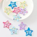 Close-up of star shaped metal hair clips with colorful polka dots and glossy finish - Polka Dot & Star
