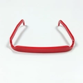 Flat lay of a red square headband made of polished plastic on a white background - Red