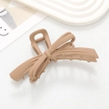 Elegant bow hair claw clip in matte khaki finish with minimalist aesthetic on white background - Khaki