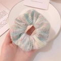 Close-up of soft mohair knit scrunchie with pastel macaron gradient colors and fluffy texture - Blue