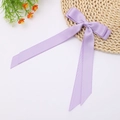 Detailed view of lavender double-layered bow hair clip with long satin ribbons on white background - Lavender