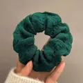 Deep green oversized scrunchie with pleated texture shown held in hand for hair styling - Dark Green
