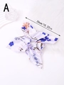 Detail shot showing a 26cm lilac floral print bow scrunchie with soft satin texture - Blue Oriental Floral