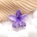 Close-up of purple gradient plumeria hair claw clip made of acrylic on a white tray - Purple
