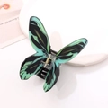 Dettaglio della molletta a farfalla con elegante sfumatura di colore nero e verde - Nero-Verde Sfumato