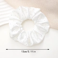 Close-up of white satin scrunchie with rhinestones showing 13cm diameter detail - White