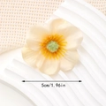 Detailed macro view of 5cm cream orange fabric flower hair clip with realistic stamens - 5cm Style / Beige