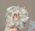 Elegant cream satin scrunchie with black rose print and matching hair clips - Black Camellia