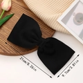 Large black fabric bow hair clip with dimensions 21cm by 9.7cm on a wooden tray - Black