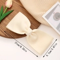 Cream-colored oversized fabric bow hair clip with dimensions 21cm long and 9.7cm wide - Beige