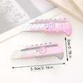 Set di 2 fermagli per capelli rosa a forma di taglierino con cuori e strass lucidi - Forma di Taglierino (D)