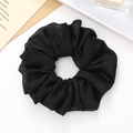 Minimalist black scrunchie with pleated shimmer fabric for women's hair styling - Black