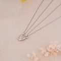 Detail of magnetic silver heart pendants for couples on a warm decorative background - Silver Arrow Heart (NST-0213-8)