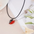 Detail of red and black magnetic heart pendants with contrasting chains for couples - Red & Black Lacquered (NST-0213-14)