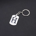 Minimalist stainless steel keychain with letter H engraved on a brushed silver plate - Letter H