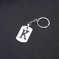 Stainless steel key ring featuring a silver rectangle pendant with a black letter K - Letter K