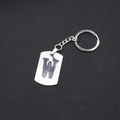 Polished stainless steel keychain featuring a minimalist cutout letter W on a shield pendant - Letter W