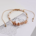 Detail of colorful beads, faceted crystal, and natural stone on adjustable woven bracelet - Champagne