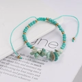 Detail of handmade woven bracelet with turquoise beads and natural raw stone accents - Green