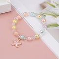 Detailed close-up of a colorful beaded girl's bracelet featuring a pink starfish charm - Single Starfish