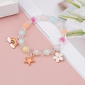 Detailed macro view of colorful pastel beads and rainbow flower charms on the girl's bracelet - Rainbow Pentagram And Flower