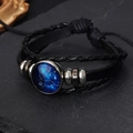 Detail of multi-layer braided leather bracelet with adjustable drawstring and zodiac sign charm - Leo