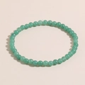 Minimalist 4mm natural green stone bead bracelet with a translucent elastic strand finish - Green Aventurine