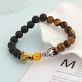 Lava stone and tiger eye beaded bracelet featuring detailed gold and silver dragon heads - Lava Stone And Tiger Eye