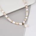 Bohemian heishi bead necklace with natural shell pendant and golden metal accents - White + Conch