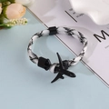 Minimalist woven aircraft bracelet with black airplane pendant and checkered pattern rope - Black & White Check