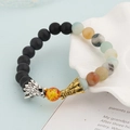 Beaded bracelet with black matte stones and dual-tone metal dragon heads charms - Black And Amazonite