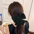 French style 8-inch dark green velvet hair bow clip for women shown on a model's hair - Bowknot Style