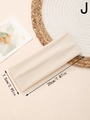 Detail view of a beige thermal knit sports headband with size labels and cozy home decor - Beige (J)