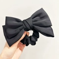 Elegant black satin oversized bow scrunchie for women with retro ponytail hair tie design - Black