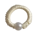Detail of a cream satin scrunchie featuring a large glossy pearl accent and elastic band - Beige
