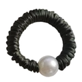 Detail of silk texture scrunchie with a large white pearl bead on black fabric - Dark Green
