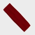 Detailed view of the dark red knitted elastic sports headband with ribbed texture design - Burgundy