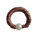 Detail of brown silk scrunchie with large white pearl accent and pleated texture - Brown
