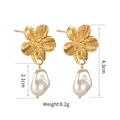 Detail view of 18K gold-plated floral earrings with textured petals and Baroque pearl drops - Brushed Flower Baroque Pearl Dangles (SFLE520)