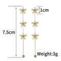 Macro detail of vintage 18K gold plated flower tassel earrings with 7.5cm length dimensions - Triple Flower Chain Tassel Dangles (SFLE591HUA)
