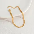 Close-up of golden stainless steel cuban link chain bracelet with lobster clasp and extender - 古巴链(S-B1089)