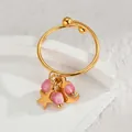 Gold stainless steel star moon tassel ring with pink beads on a stone pedestal - Pink Round Bead
