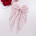 Detail of oversized white bow hair clip with red heart and rainbow patterns for Valentines - White Base Arch Heart