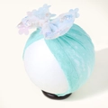 Detail of mint green lace baby headband with sequined bow on white display head - Green Texture With Trim