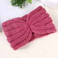 Detailed knit texture of a rose pink winter headband with a stylish twist design - Rose Red