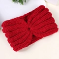 Close-up of red cable knit headband with a stylish crossover twist design and soft texture - Red