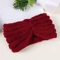 Macro detail of wine red knitted headband with twist knot design and ribbed texture - Burgundy