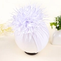 Close-up of baby white turban hat with a large layered flower and sparkling rhinestone - White