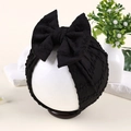 Vue détaillée du bandeau bébé noir avec tissu en maille texturé à bulles et grand nœud - Noir