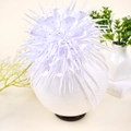 Infant headband featuring a large white satin camellia flower with sparkling crystals - White
